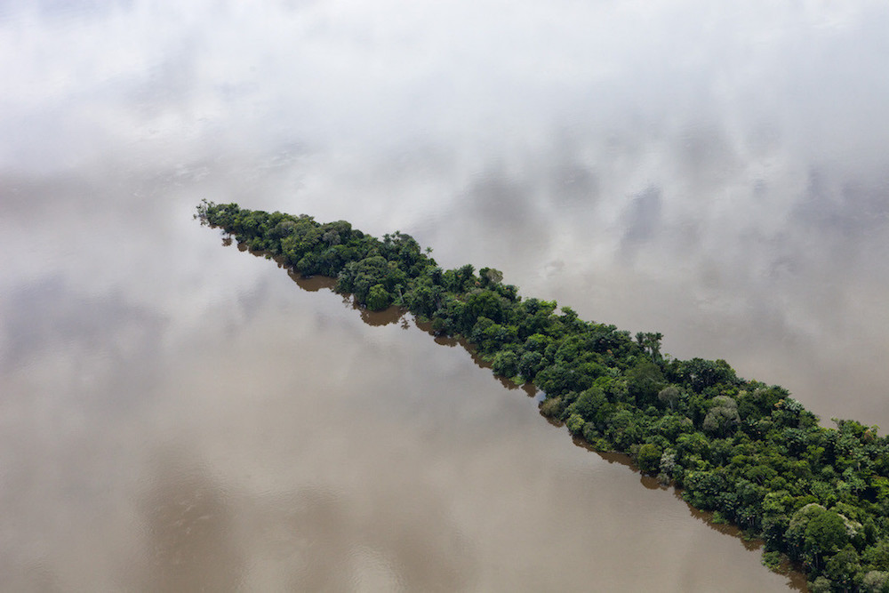 Para, Brazil. February 11, 2012. Aerials south of Santarem and along the road BR163. Rainforest in the Tapajós River, coordinates: -4.737923-56.448047. Photo by Daniel Beltra for Greenpeace