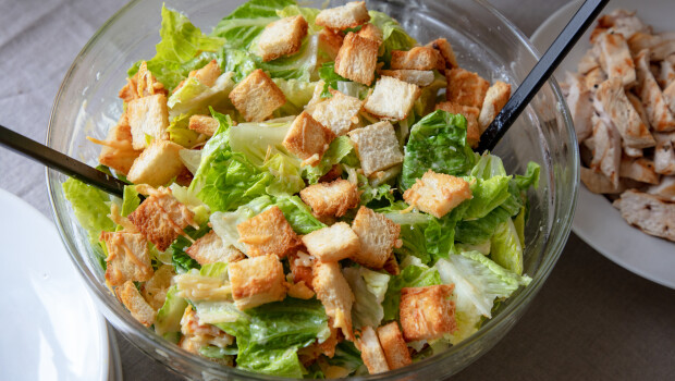 bowl of homemade cesar salad with grilled chicken