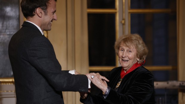 French President Emmanuel Macron awards Canadian novelist Antonine Maillet with the Legion of Honor at the Elysee Palace in Paris, Wednesday, Nov. 24 , 2021. (Yoan Valat/Pool Photo via AP)